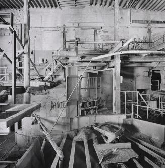 A photograph of the interior of a clay processing building within a brick works.