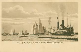 Sepia toned photograph of sail boats and a ferry on open water.