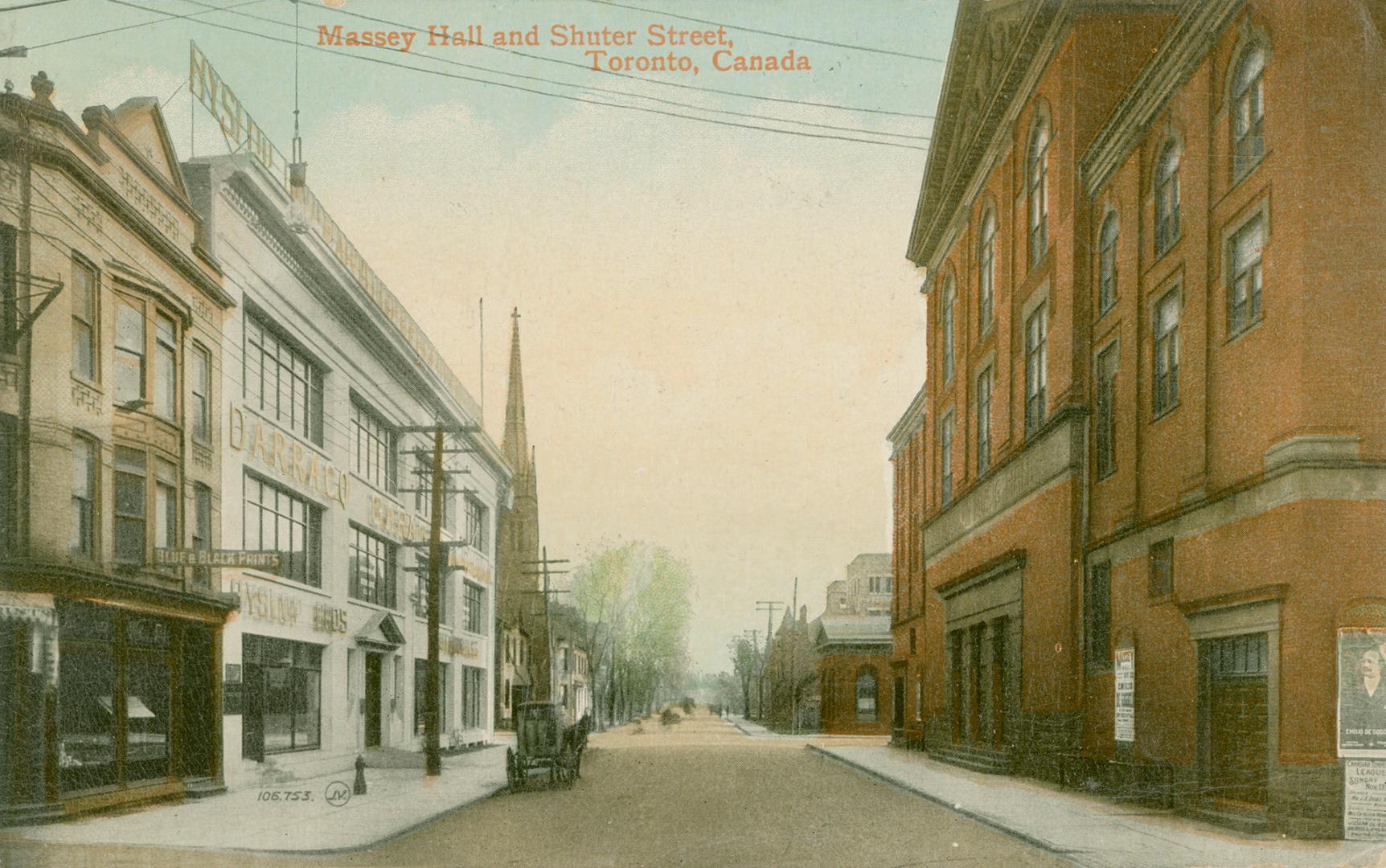 Colorized photograph which shows a city street and a huge theater building on the right.