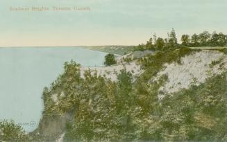 Colorized photograph of cliffs, lake and trees.