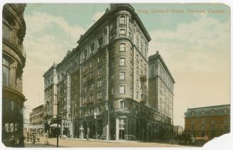 Colorized photograph of an eight story hotel building taken from an angle showing the front and ...