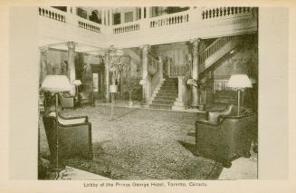Black and White photograph of a lavish hotel lobby. Staircase and balcony.