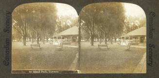 Pictures show benches in a park in front of a covered bandstand