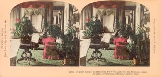 Colorized pictures show a living room in a large house.
