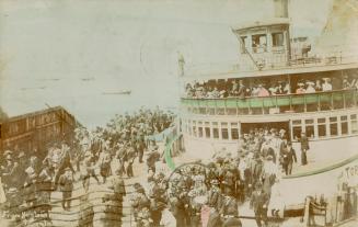 Colorized photograph of a ferry docked and passengers disembarking.
