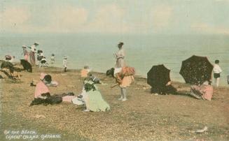 Colorized photograph of people enjoying themselves on a beach.