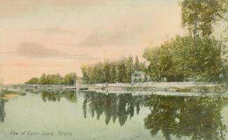 Colorized photograph of a lagoon with a building to the right.