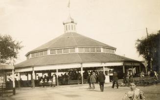 Black and white photograph of a merry-go-round.