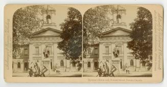 Pictures show a statue in front of a two story collegial building.