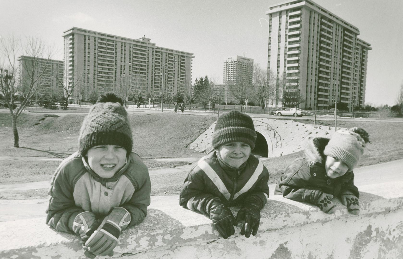 Photograph of children playing in Flemingdon Park (black and white).