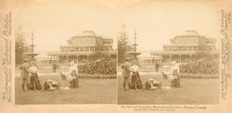 Pictures show people wandering in a large formal garden with a fountain and Victorian house in  ...