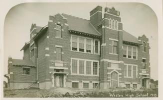 Black and white photograph of a two story school building.