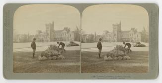 Pictures show two men admiring a flower bed in front of a huge, gothic school building