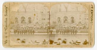 Pictures show soldiers standing in front of the archways of a Richardsonian Romanesque building ...