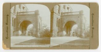 Pictures show a covered entrance to a huge stone building with a man and a horse standing under ...