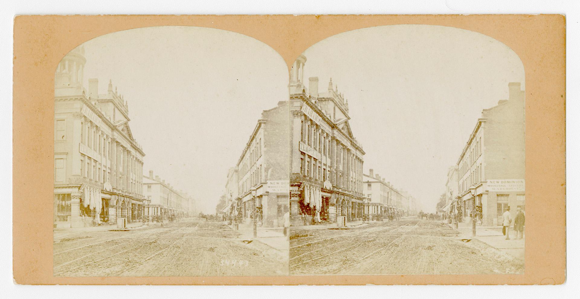 Pictures show a city street with large buildings on each side.