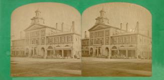 Pictures show a two story public building with a larger three story part in the centre.