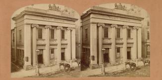 Pictures show a three story neo-classical type building with four columns in the front.