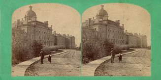 Pictures show a man and boy standing in front of a huge stone hospital building with a central  ...