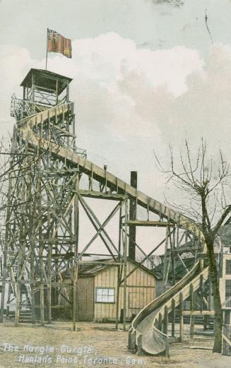 Picture of tall wooden amusement park slide.