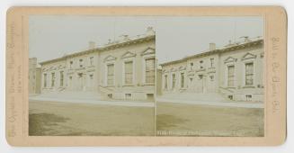 Pictures show a two story public building with a central front door.