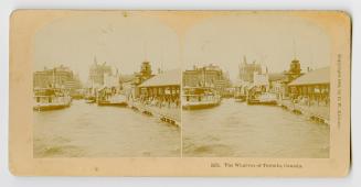 Pictures show a wharf in front of a busy city with people and boats.