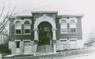 Picture of two storey library with two front pillars. 