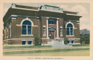 Picture of one storey public library building with front pillars. 