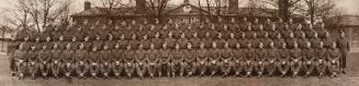 A photograph of a Canadian military regiment with approximately one hundred soldiers, seated an ...