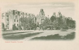 Black and white photograph of a huge four story hospital building on a treed lot.