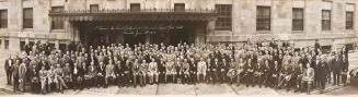 A photograph of a large group of people posing in front of the Royal York Hotel in Toronto. All ...