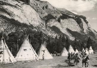 Leaving their Teepee camp at Banff for their parade through the Alberta foothills city are members of Stoney, Sarcee and Blackfoot tribes taking part (...)