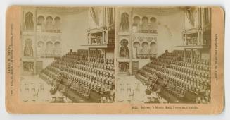 Pictures show rows of seats in a large concert hall.