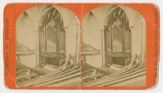 Pictures show pews and organ pipes inside a large church.