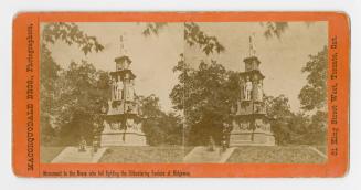 Pictures show two men sitting on steps in front of an Italian Renaissance style monument.