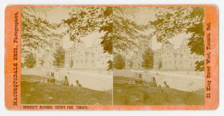 Pictures show a family sitting on the lawn in front of a huge collegiate-gothic building.