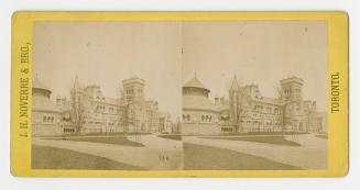 Pictures show a very large collegiate gothic building with a round building to the west of it.