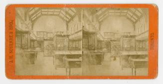 Pictures show display cases in side a large room with a glass ceiling.