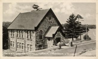 Black and white photograph of a stone, country church.
