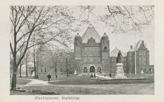 A photograph of a large building in the Richardson Romanesque style, with a large lawn with pat ...