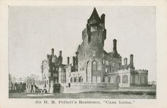 A photograph of a large castle-style mansion in a Gothic Revival style, with many turrets and a ...