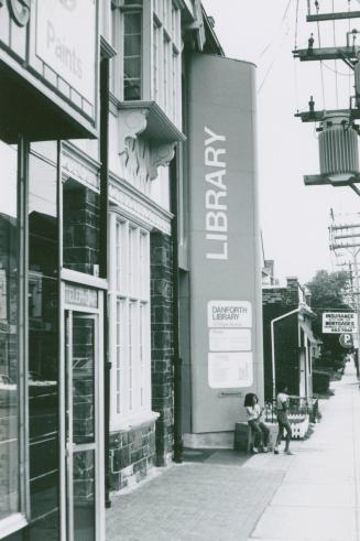 Picture of library showing large sign. 