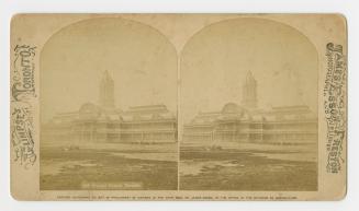 Pictures show a huge four story steel and glass building with a central tower.