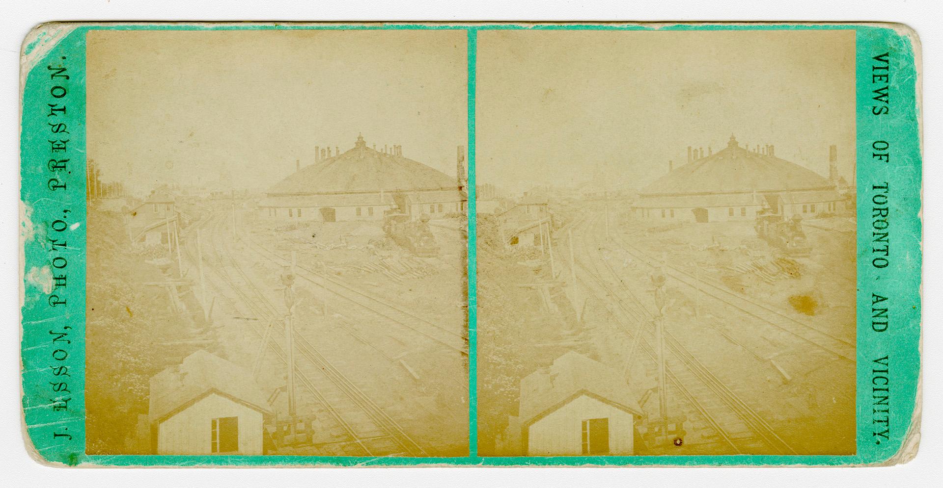 Pictures show railway tracks with a round building in the background.