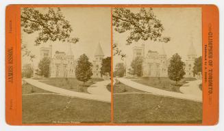 Pictures show lawns and walkways in front of a huge collegiate-gothic complex.