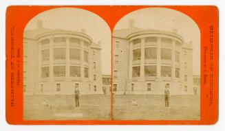 Pictures show a man and boy on the lawn in front of a three story, bared sitting porch which ha ...