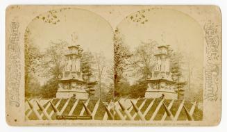 Pictures show an Italian-Renaissance style monument on a hill behind a picket fence.