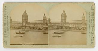 Pictures show boats on a body of water in front of a long industrial building wit three tower.