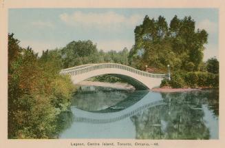 Colorized photograph of a curved bridge over a narrow body of water