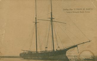 Picture of a large sailing ship with sails down. 